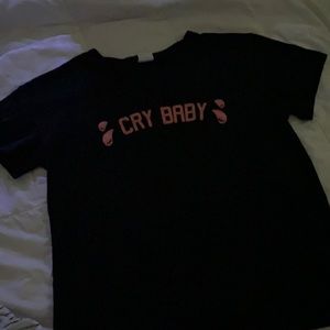 A black “Cry Baby” crop top.